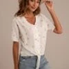 White Floral Short Sleeve V Neck Buttons Top 1 White Floral Short Sleeve V Neck Buttons Top -Saucony Store brlt22032403 1